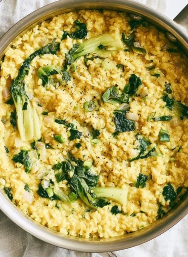 Creamy coconut rice served in a bowl with herbs and spices for anti-inflammatory benefits