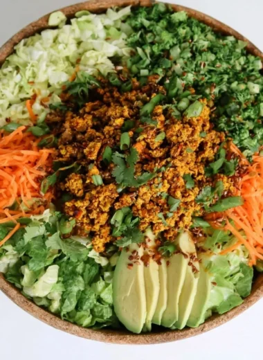 Cozy egg roll salad with colorful veggies and savory sauce in a bowl