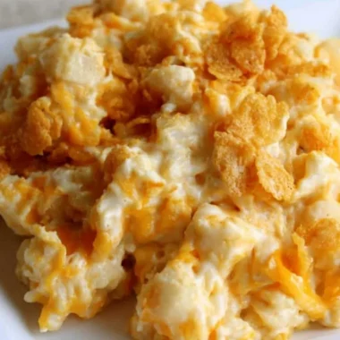 Delicious creamy funeral potatoes with a crispy topping, perfect for gatherings.