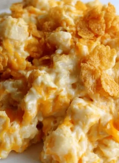 Delicious creamy funeral potatoes with a crispy topping, perfect for gatherings.