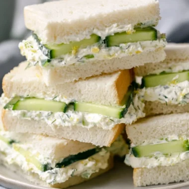 Delicious cucumber sandwich with fresh ingredients on a plate