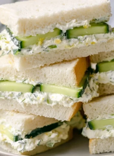 Delicious cucumber sandwich with fresh ingredients on a plate