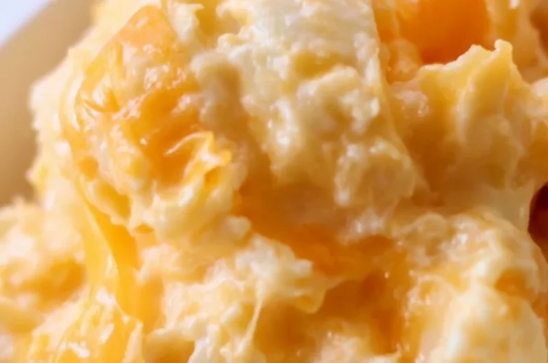 Easy Cheesy Potato Casserole topped with melted cheese and crispy bits.