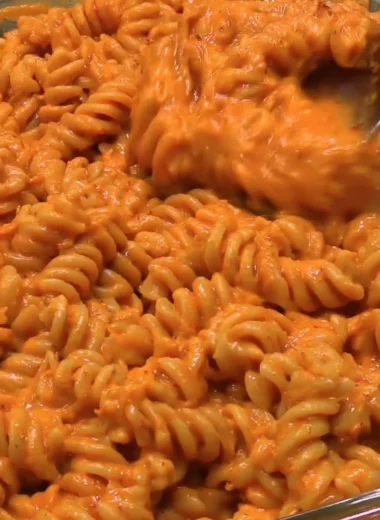 High protein creamy tomato pasta with fresh herbs and cheese