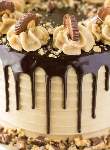 Peanut Butter Chocolate Layer Cake with rich frosting and layers of chocolate