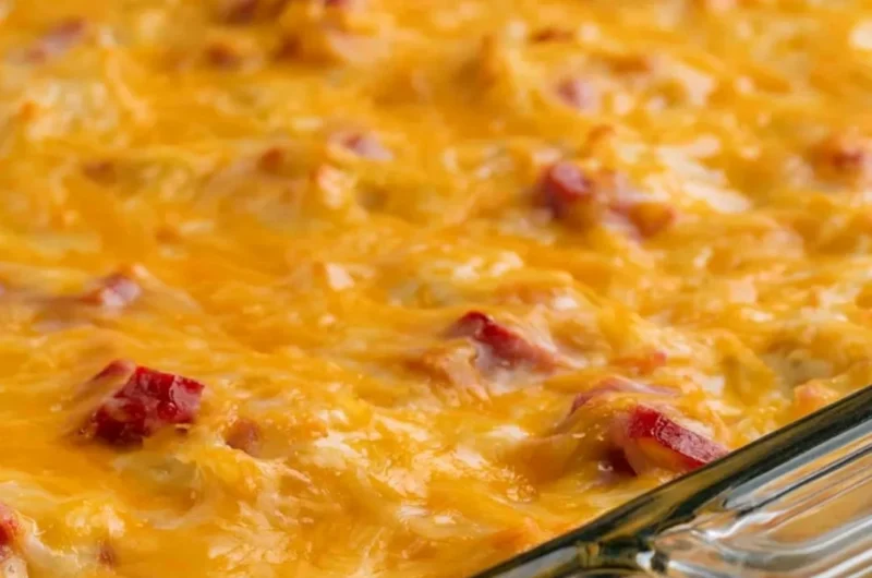 Delicious Super Cheesy Ham and Potato Casserole topped with gooey cheese